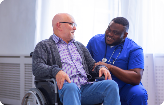 caregiver with senior man on a wheelchair