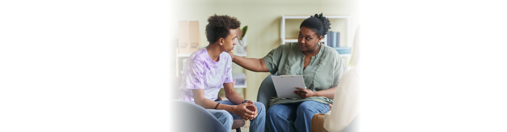 psychologist talking to a teenage boy